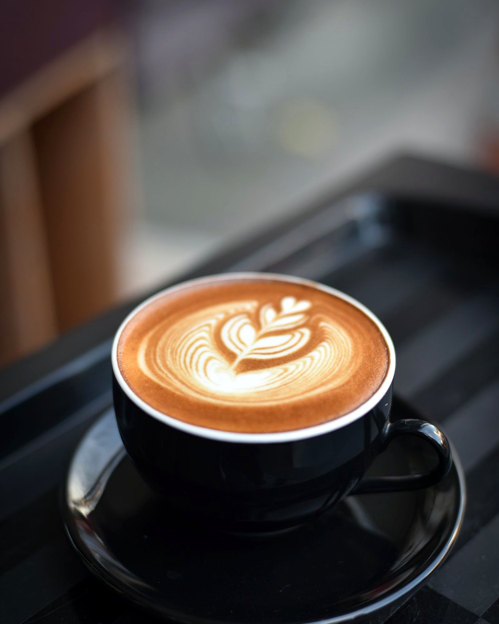 Cappuccino with latte art at Oltian in Hendon