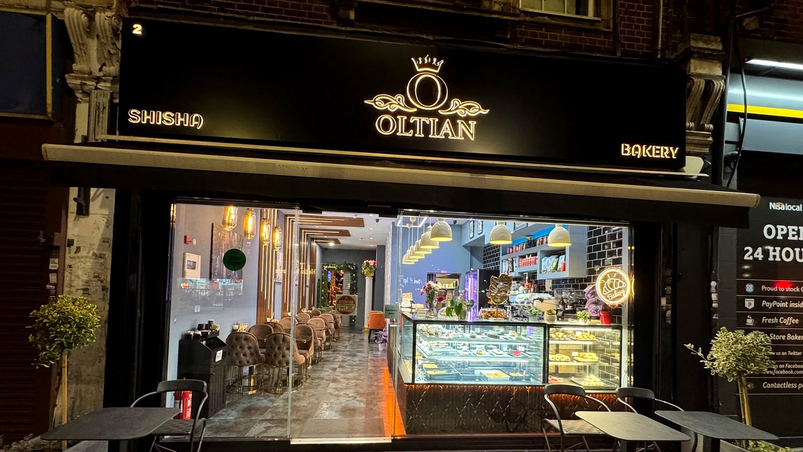 Oltian Shisha & Bakery storefront at 2 Watford Way, Hendon, at night